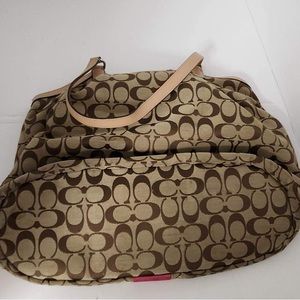 Coach bag, tan and brown with pink stripe.